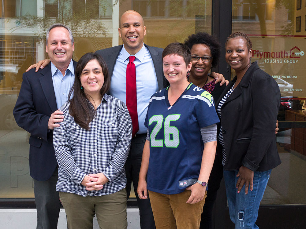 Celebrating a great mini-summit! Clockwise from upper left: Paul Lambros, Senator Cory Booker, Rainelle Sizemore, Trina Thompson, Marilyn Mitchell, and Kelli Larsen.