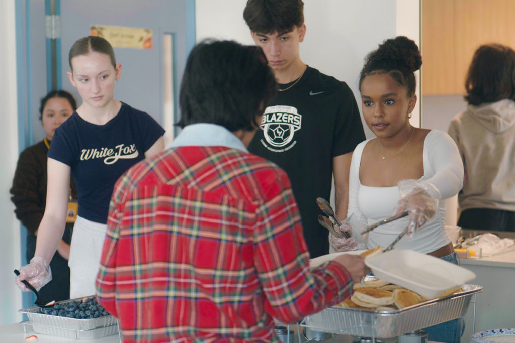 At Toft Terrace, middle and high school students from the Bush School showcased their culinary skills by preparing a delightful brunch for residents, fostering connections through the joy of shared meals.