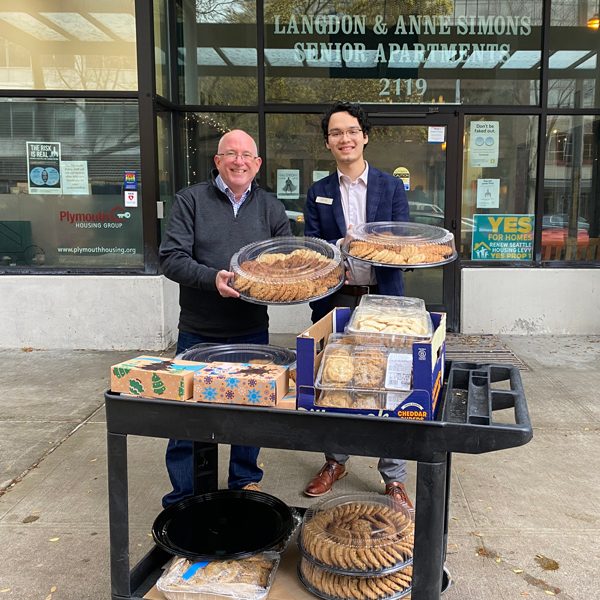 Marriott volunteers drop off cookies at Plymouth Housing building