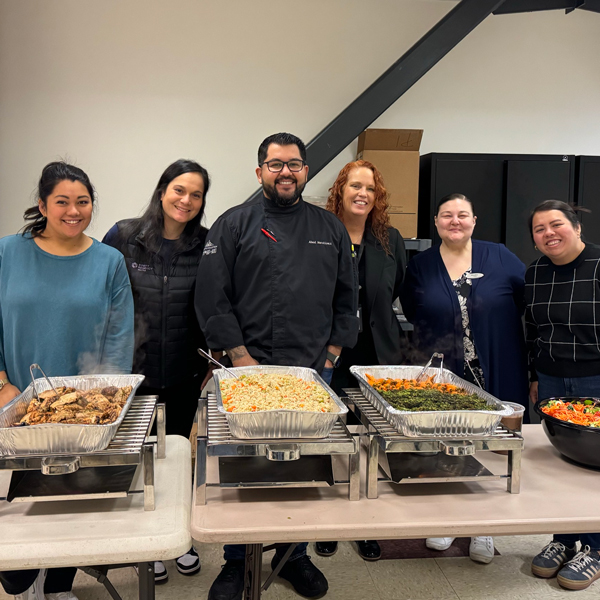 Microsoft staff members volunteer to serve a meal to Plymouth Housing residents