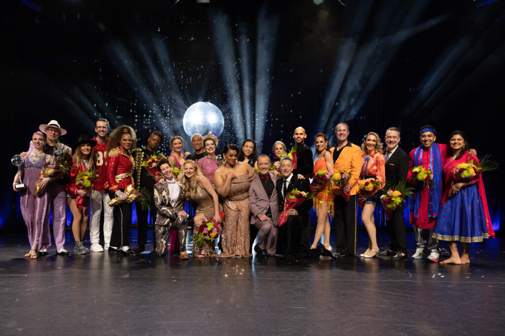 Dancers pose on a stage